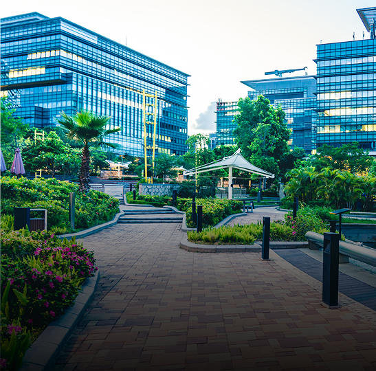 Modern office buildings with landscaped garden path.
